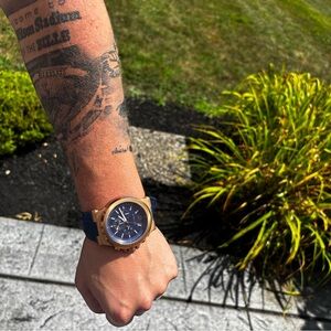 Gold and Black Watch with Blue Strap